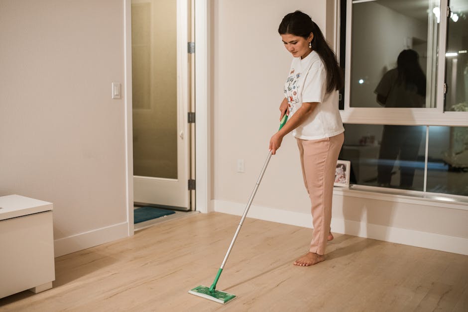 Cleaning expert mopping hardwood floor